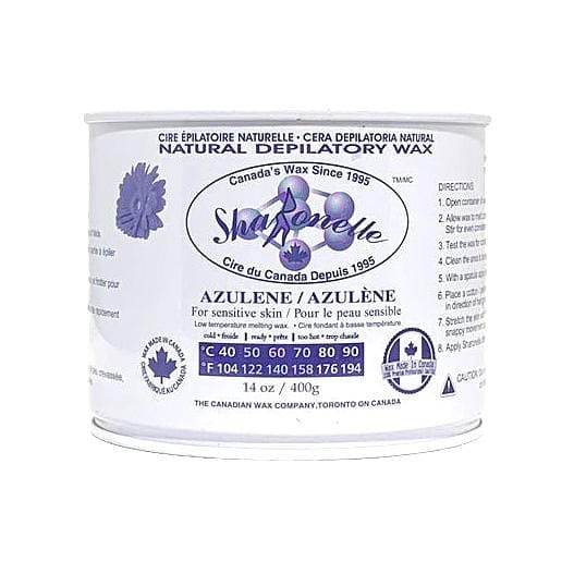 A 14 oz can of Shag Ape Natural Depilatory Wax by The Canadian Wax Company, featuring a white label with purple text and graphics on a white background.