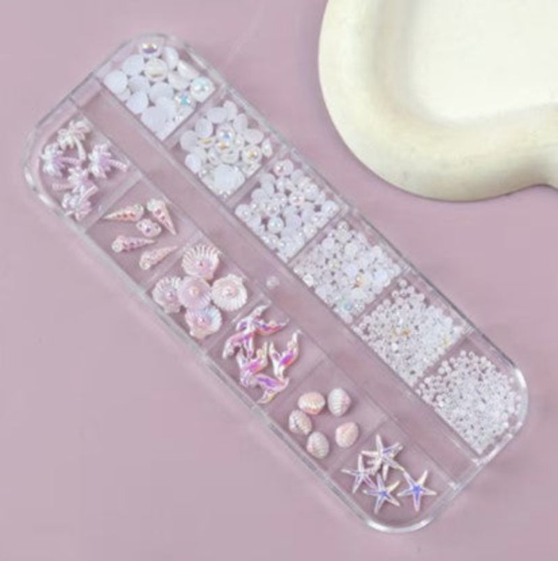 Clear nail art organizer with decorative elements on a pink background