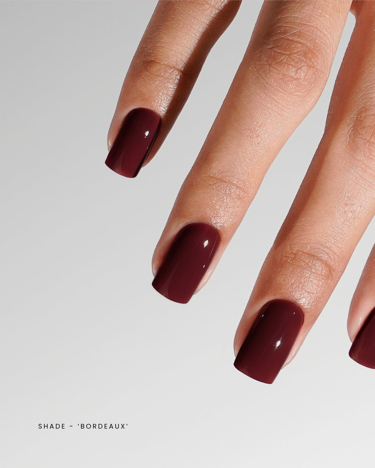Akzentz Luxio Bordeaux gel polish shown on manicured nails