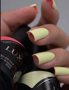 Akzentz Luxio Glow 15 mL gel polish bottle shown with a manicure