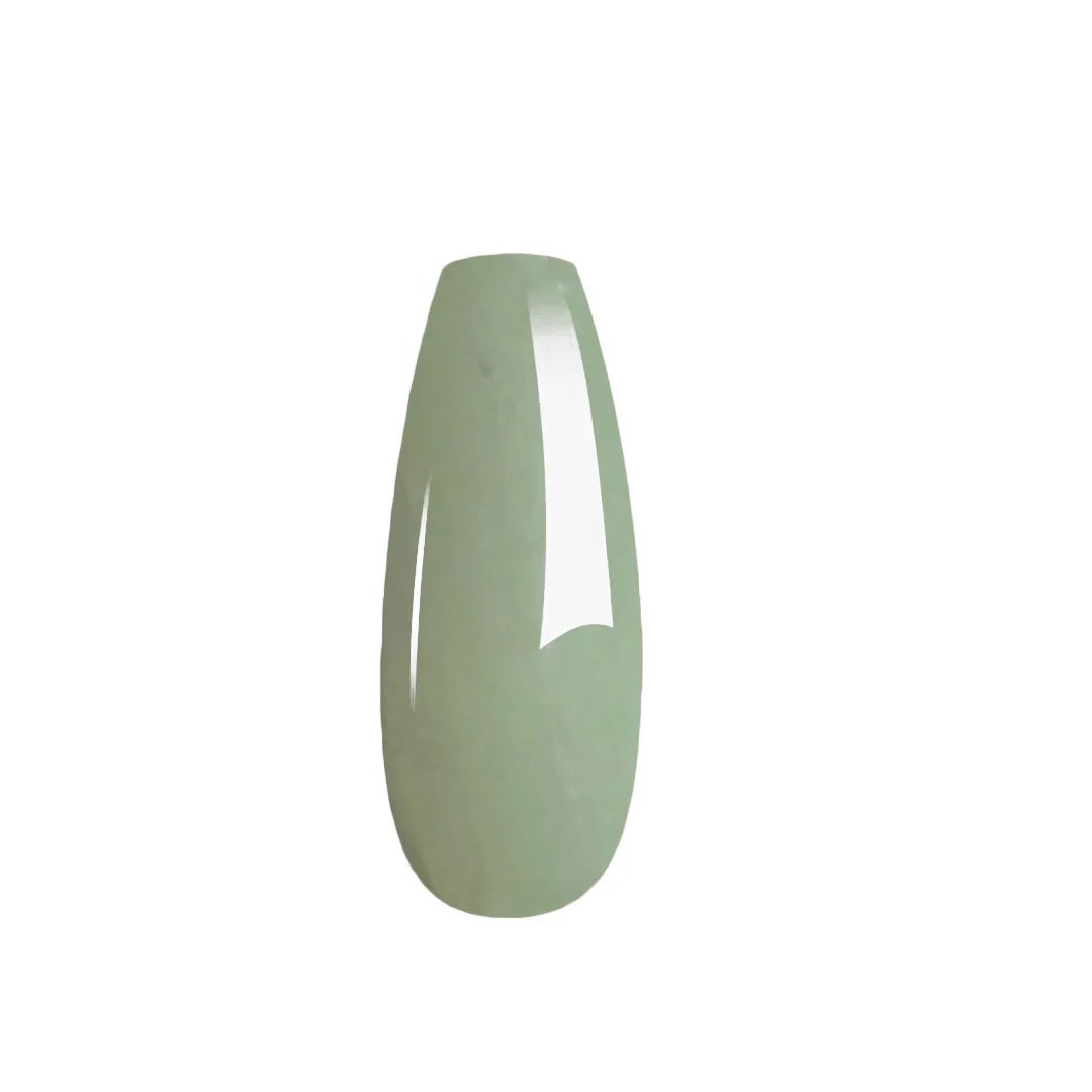 Green glass vase on a white background
