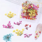 Clear resin phone case with pressed flowers on a textured white surface