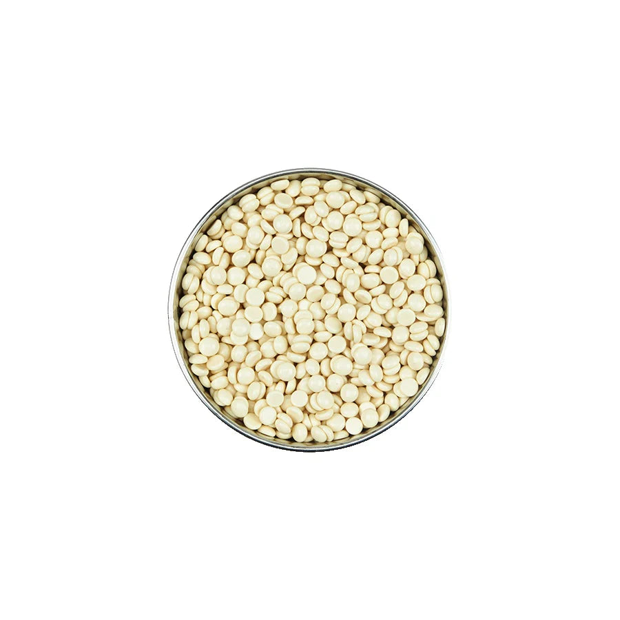 Metallic container filled with small, round, beige beads on a white background