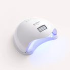 White nail dryer with digital display on a white background