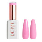 A bottle of BE-MI Beauty Box gel nail polish in a bright pink shade, shown next to two artificial nail tips painted in the same pink color, on a light gray background.