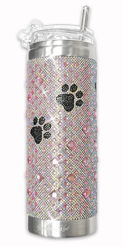 Silver tumbler with rhinestone pattern and paw prints on a white background