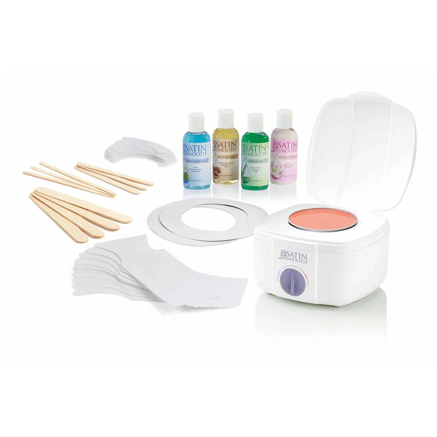 A waxing kit on a white background, featuring a white electric wax warmer with a pink wax pan, four bottles of Synvin Wax solutions, wooden spatulas, cotton pads, and a ring template.