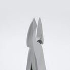 Close-up of metallic gray pliers or tweezers against a clean light gray background.